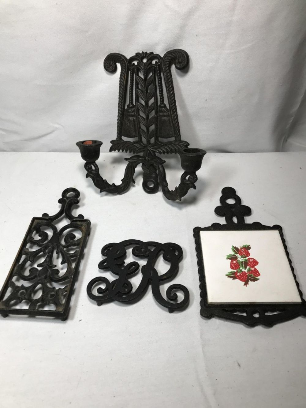 Lot 257: Trivets and Candle Holder Collection .