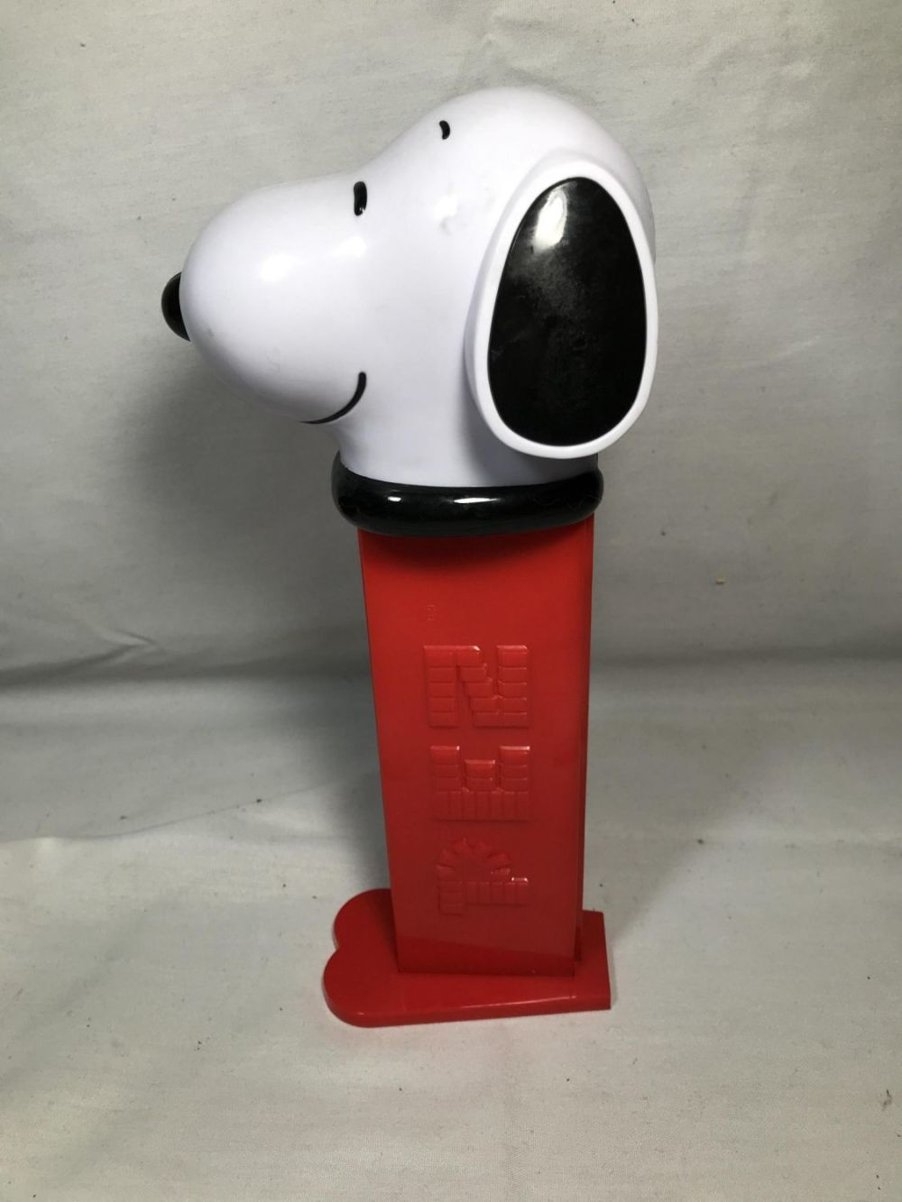 Lot 264: Early Collectible Snoopy Pez Dispenser Plays Charlie Brown Theme Measures 12 inches tall