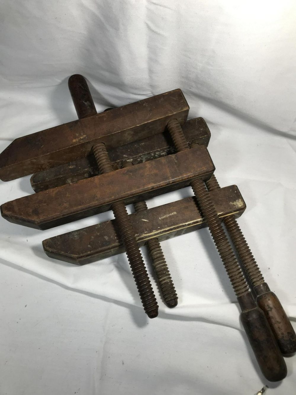 Lot 271: Primitive Wood Clamps- C Kurtzman & Co. Each measures approximately 24 inches long