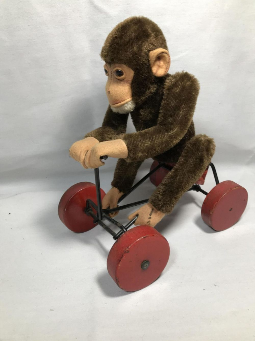 Lot 274: Vintage Monkey on Cart Childâ€™s Toy- Steiff ? Mohair monkey  Measures 11 inches tall by 9 inches