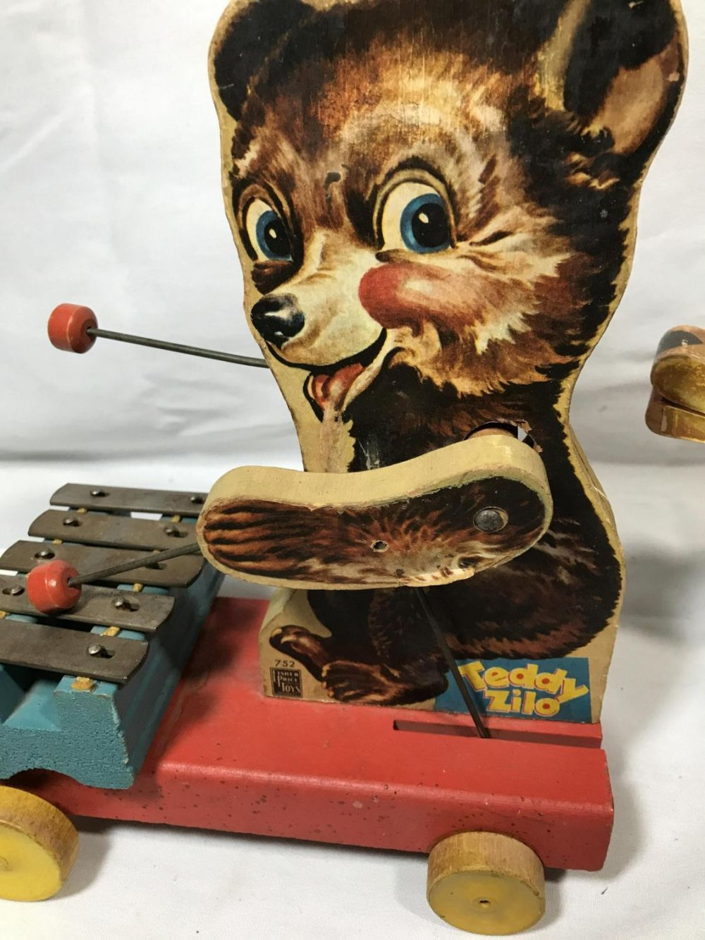 Lot 282: Vintage Fisher Price Pull Toy Teddy Zillo Measures 11 inches tall by 10 inches wide by 5 inches