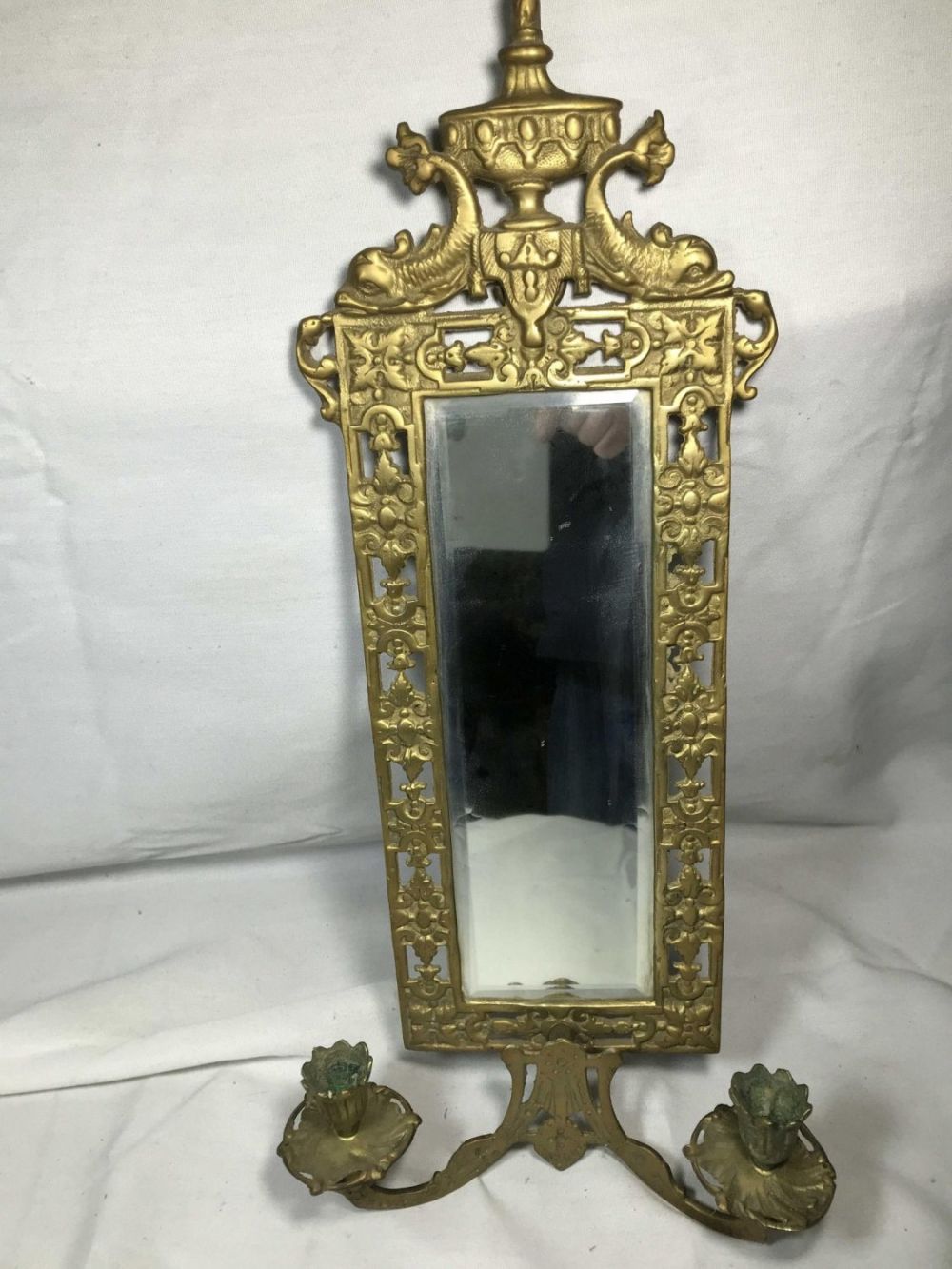 Lot 296: 1890s Brass and Beveled Mirror Measures 21 inches tall by 10 inches wide