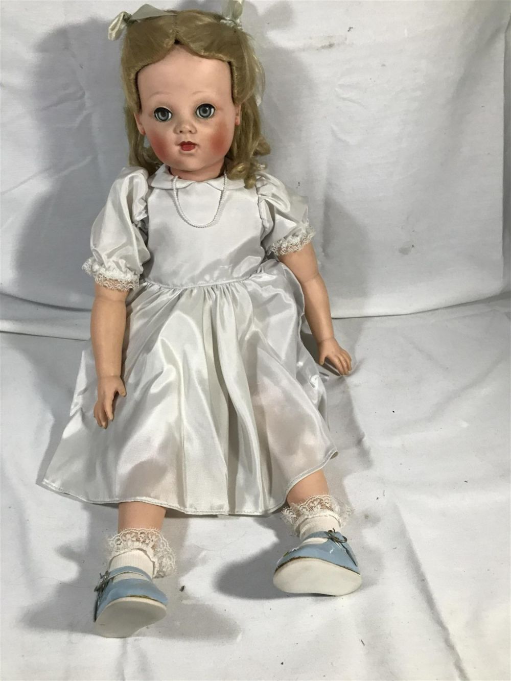 Lot 158: Vintage rubber face arms and legs doll with black body.