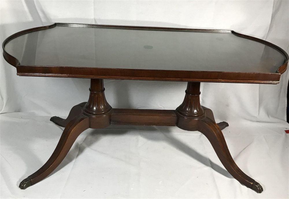 Lot 169: Imperial Antique Mahogany Dunkin Phyfe Table tempered glass top height is 17 length is 37 deaths is