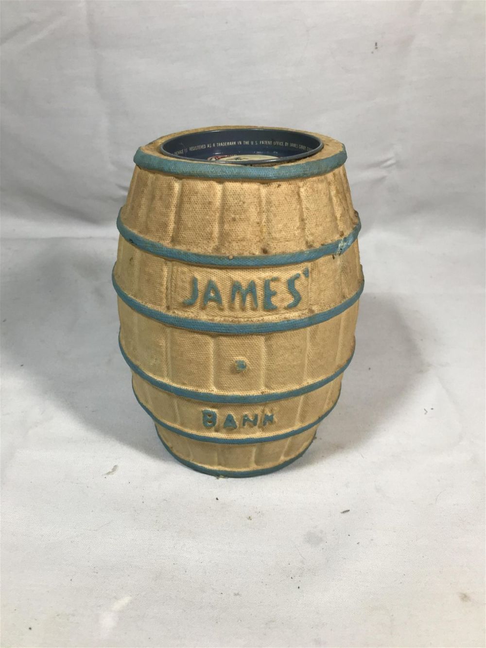 Lot 172: James bank barrel  clown  metal top, height 7 inches width is 6 inches metal cap is 3 1/4 inches