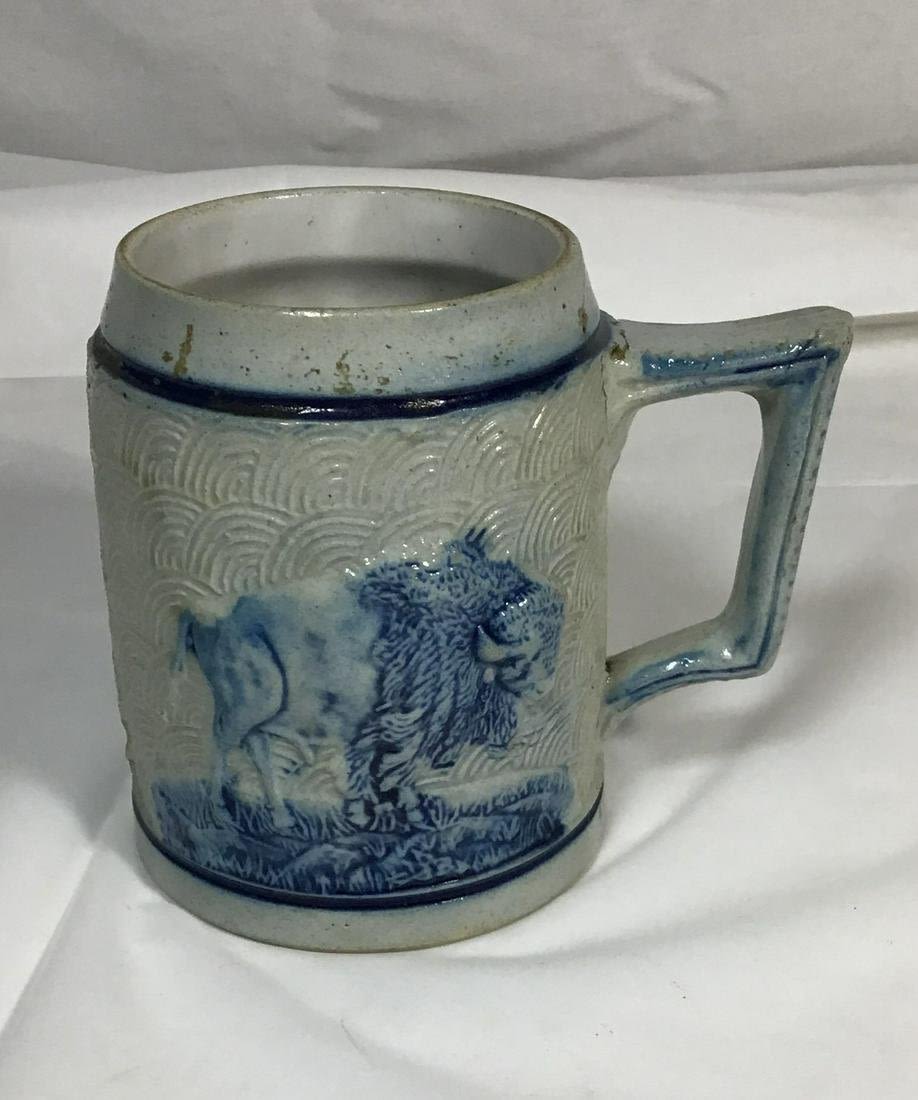 Lot 195: Vintage salt glazed mug with buffalo on one side and beer drinkers on the other