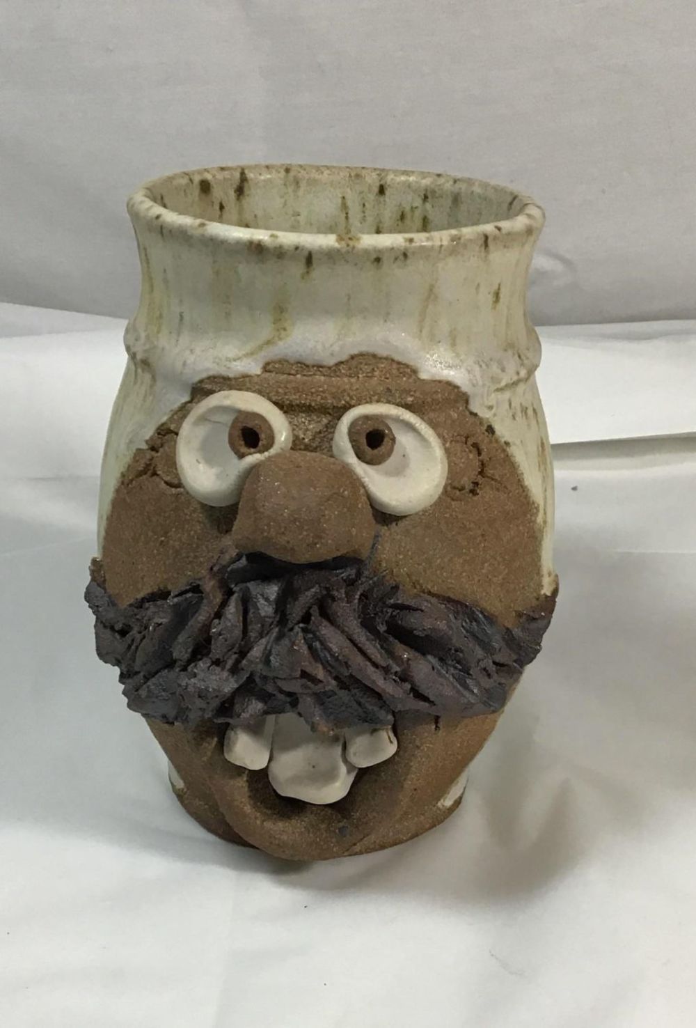 Lot 196: Hand crafted ugly mug , Groome .