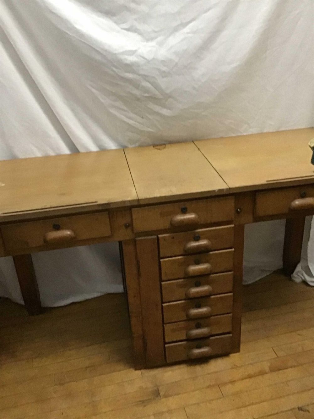 Lot 219: Vintage Mulitdrawer Drafting table Measures 30 inches tall by 56 inches wide by 20.5 inches depth