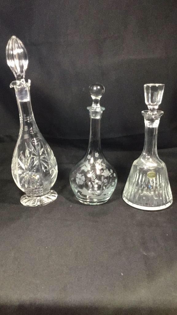 Lot 223: Vintage Carved Crystal, & Lead Crystal Decanters .