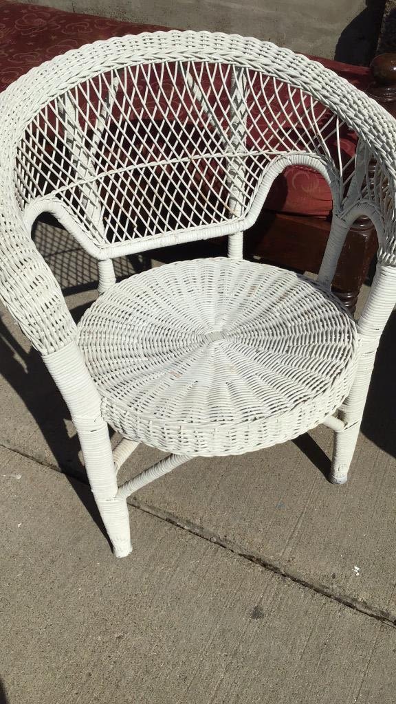 Lot 262: Wicker Chair measures 29 inches tall by 27 inches wide