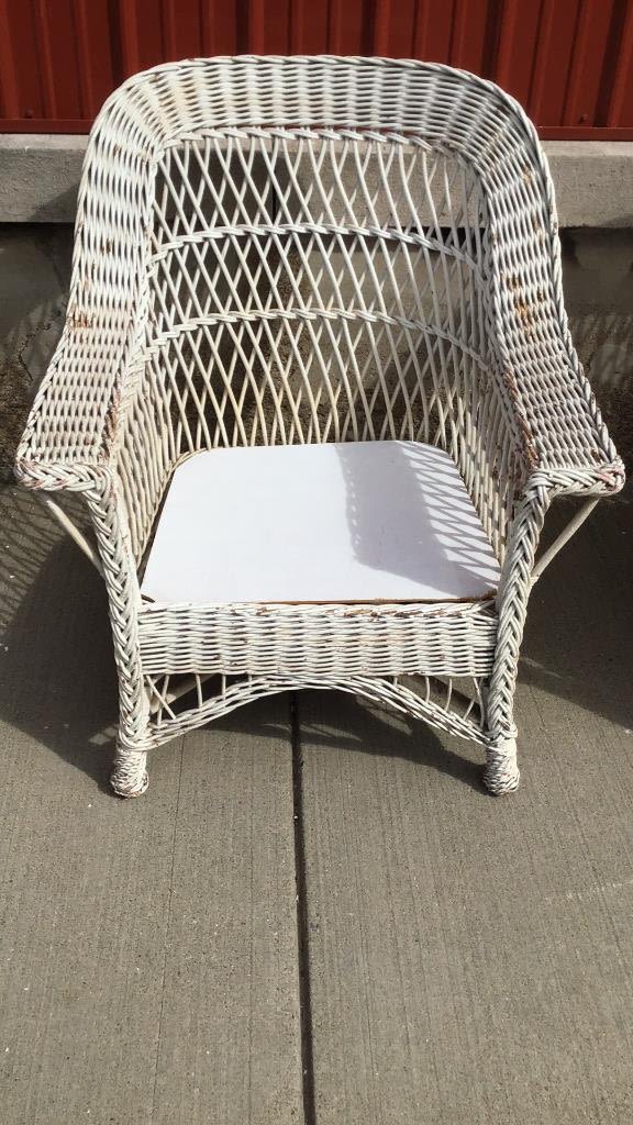 Lot 265: Wicker Chair measures 36 inches tall by 30 inches wide