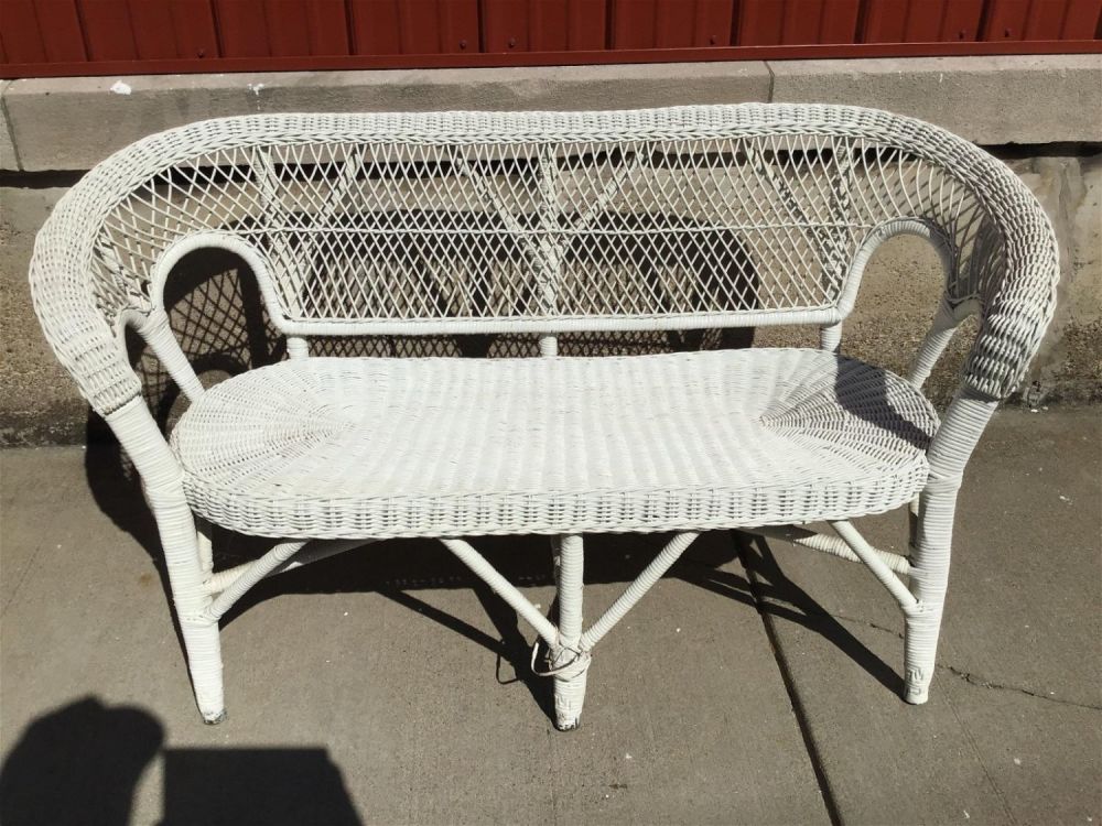 Lot 274: Wicker Loveseat Measures 29 inches tall by 54 inches wide