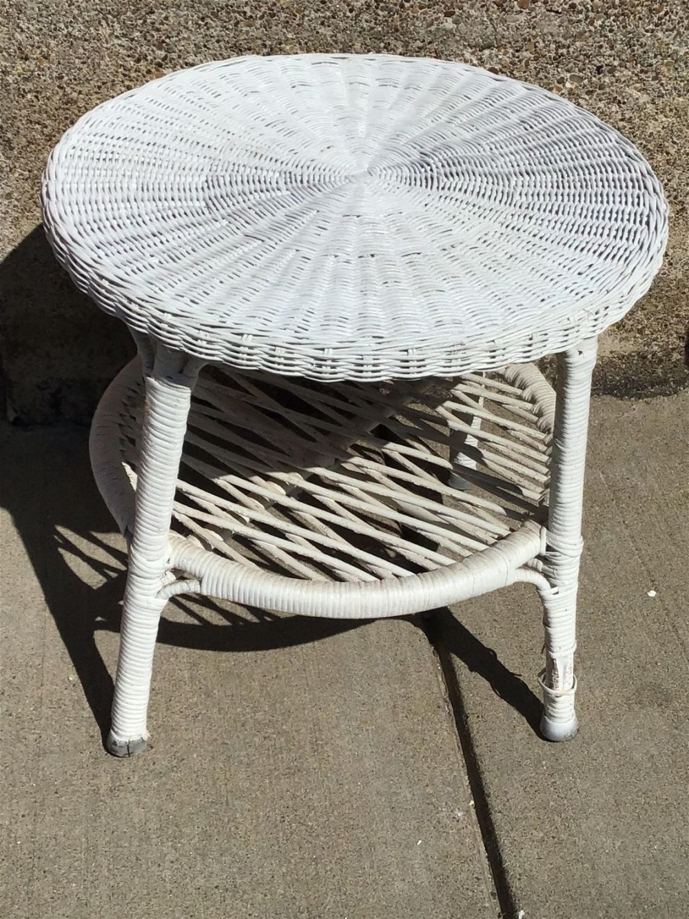 Lot 275: Wicker End Table Measures 19 inches tall by 20 inches diameter