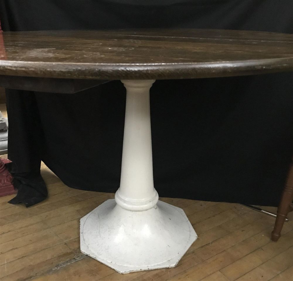Lot 281: Iron Base Table Measures 29 inches tall by 42 inches diameter