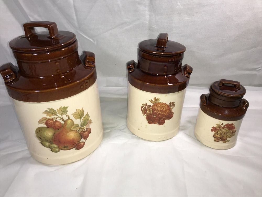 Lot 301: McCoy Jar Set Largest is 9 inches tall without lid