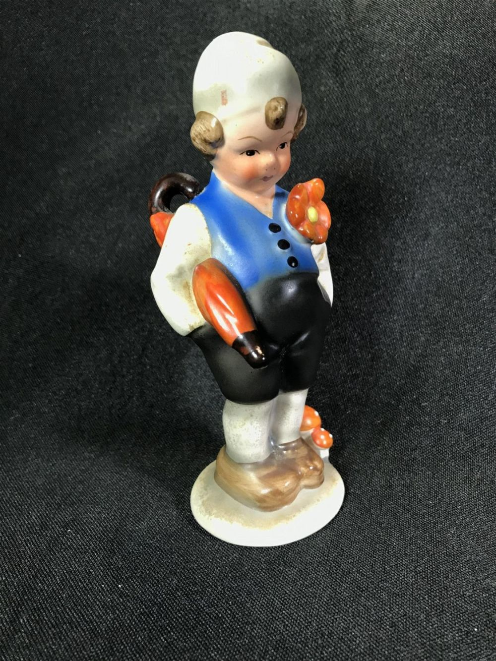 Lot 150A: Umbrella Boy Porcelain Figurine .