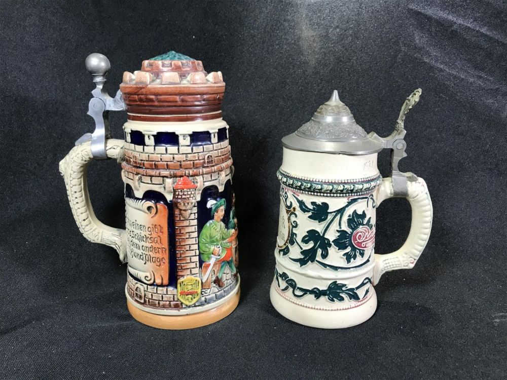 Lot 172: Vintage Beer Steins Castle Stein measures 7 inches tall  Flower Stein measures 6 inches tall
