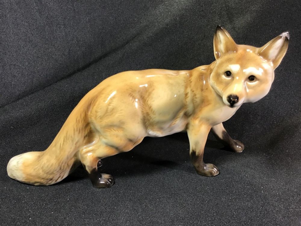 Lot 186: Porcelain Fox measures 5 inches tall by 9.5 inches wide
