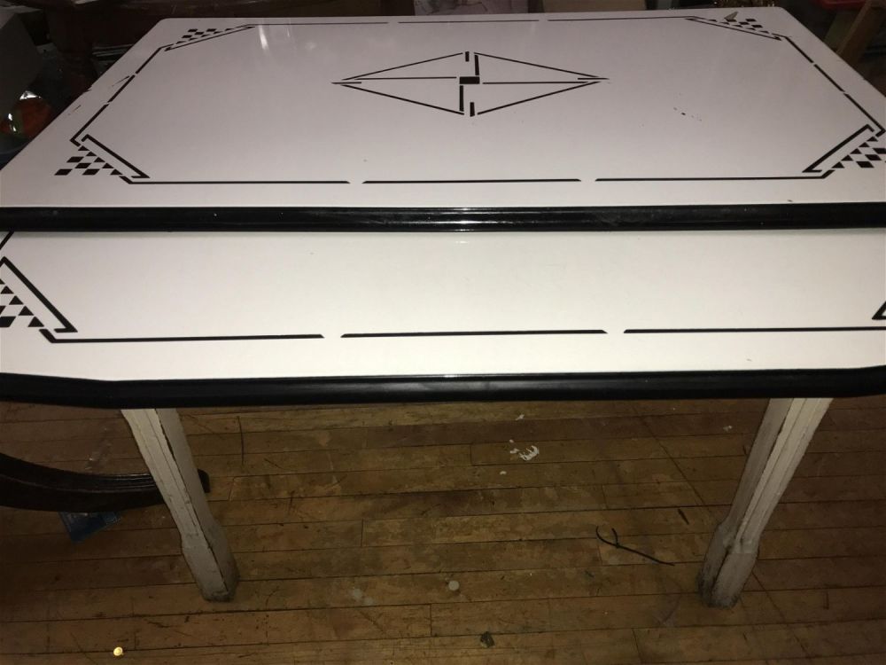 Lot 158: Deco Geometric Porcelain Top Table Measures 32 inches tall by 40 by 25 inches