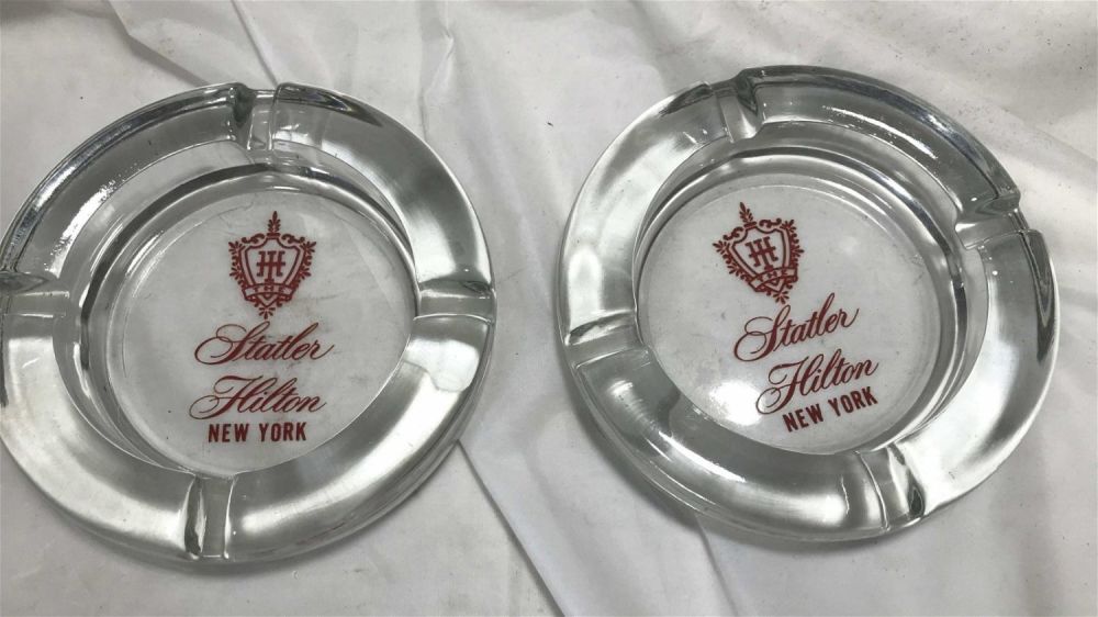 Lot 176: Statler Hilton NY Advertising Ashtrays Each measures 4.5 inches diameter
