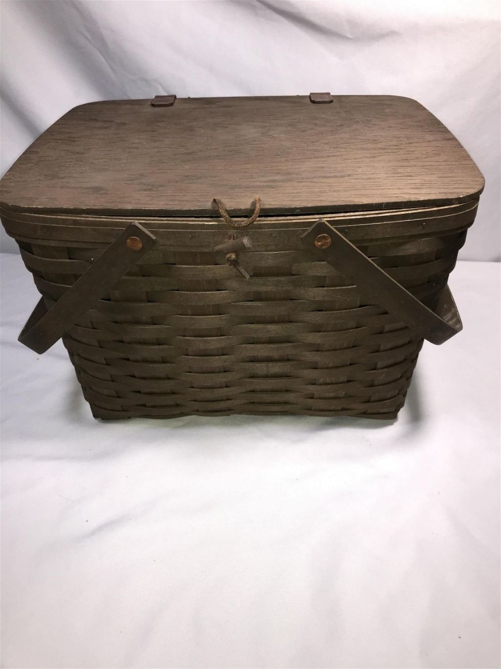 Lot 186: Longaberger Handmade Basket Signed Measures 11 inches tall by 16.5 inches wide by 14.5 inches