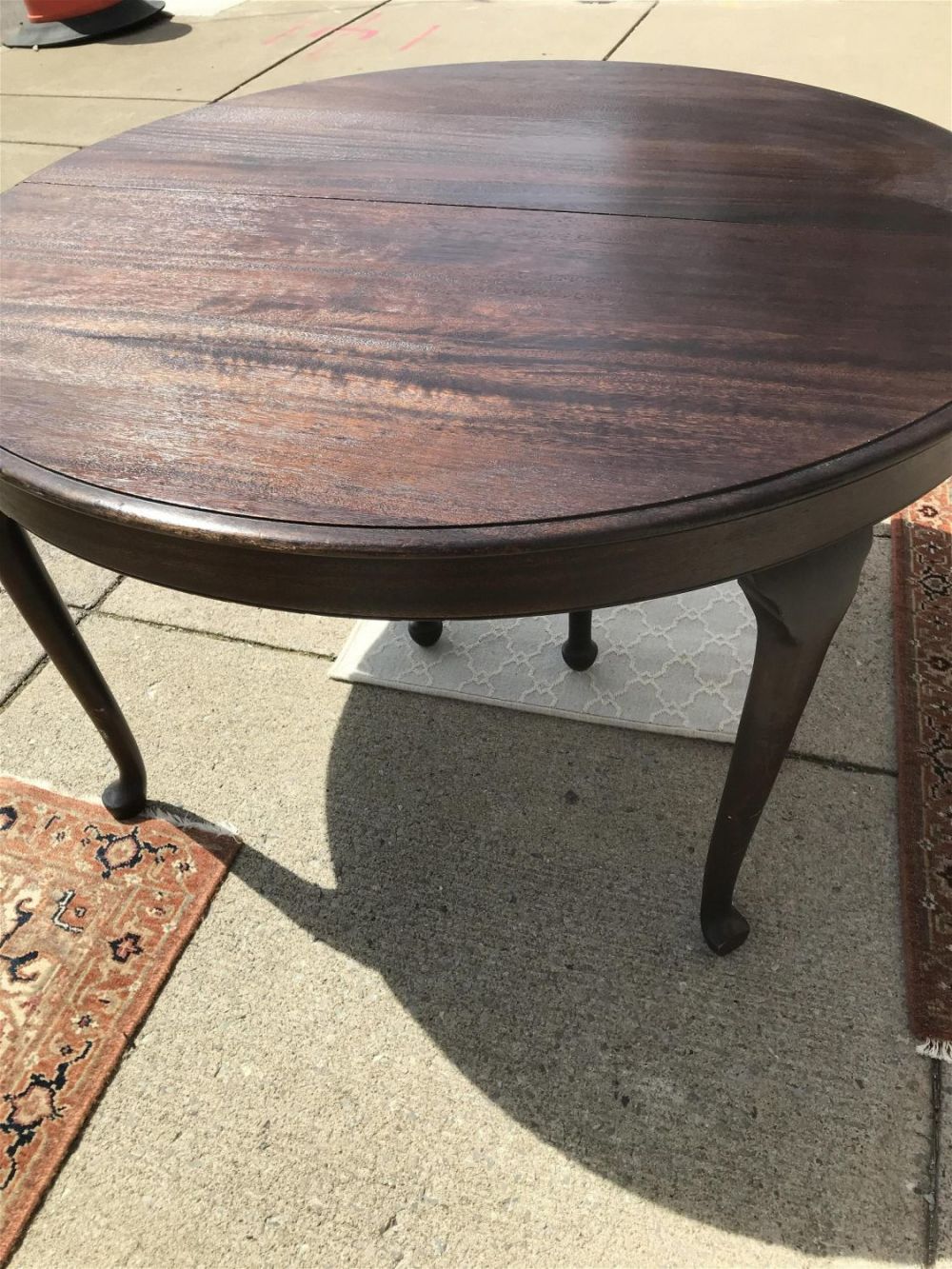 Lot 189: Dining Table w/ 4 Leaves and Table Pads measures 31 inches tall by 53 inches diameter without leaves