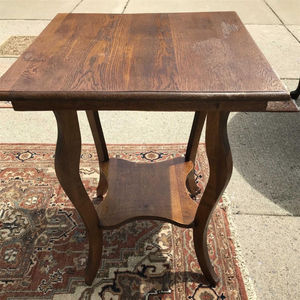 Lot 203: Vintage 2-tier end table Measures appr.  28.5 inches tall by 24 inches square