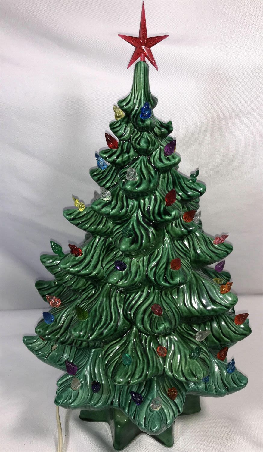 Lot 232: Light Up Christmas Tree Measures 16 inches tall by 9 inches wide