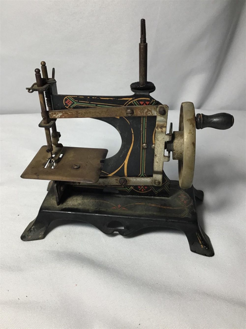 Lot 182: German Mini Sewing Machine Measures 6.5 inches tall by 7 inches wide