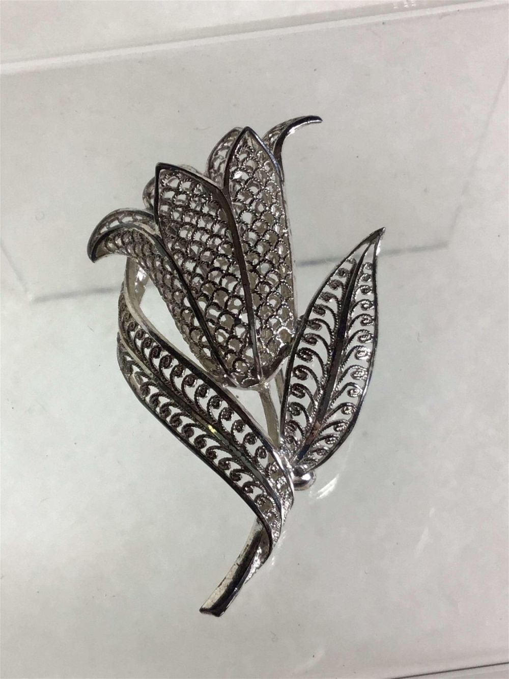 Lot 170: Sterling Filagree Floral Brooch .