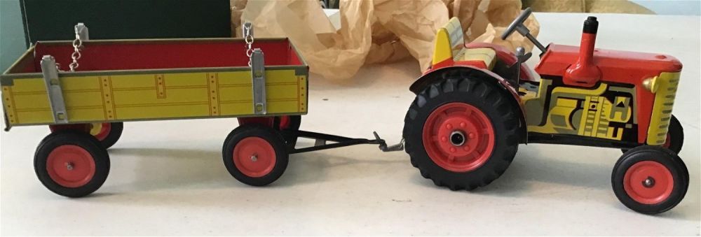 Lot 158: Vintage world of science tractor and wagon .