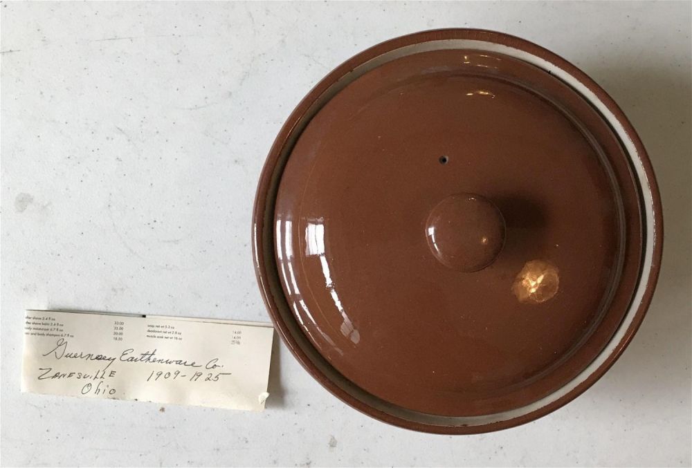 Lot 166: Vintage red Clay pot Guernsey Earthenware Co. 1909-1925 measures to be 4 inches tall with a 7 inch