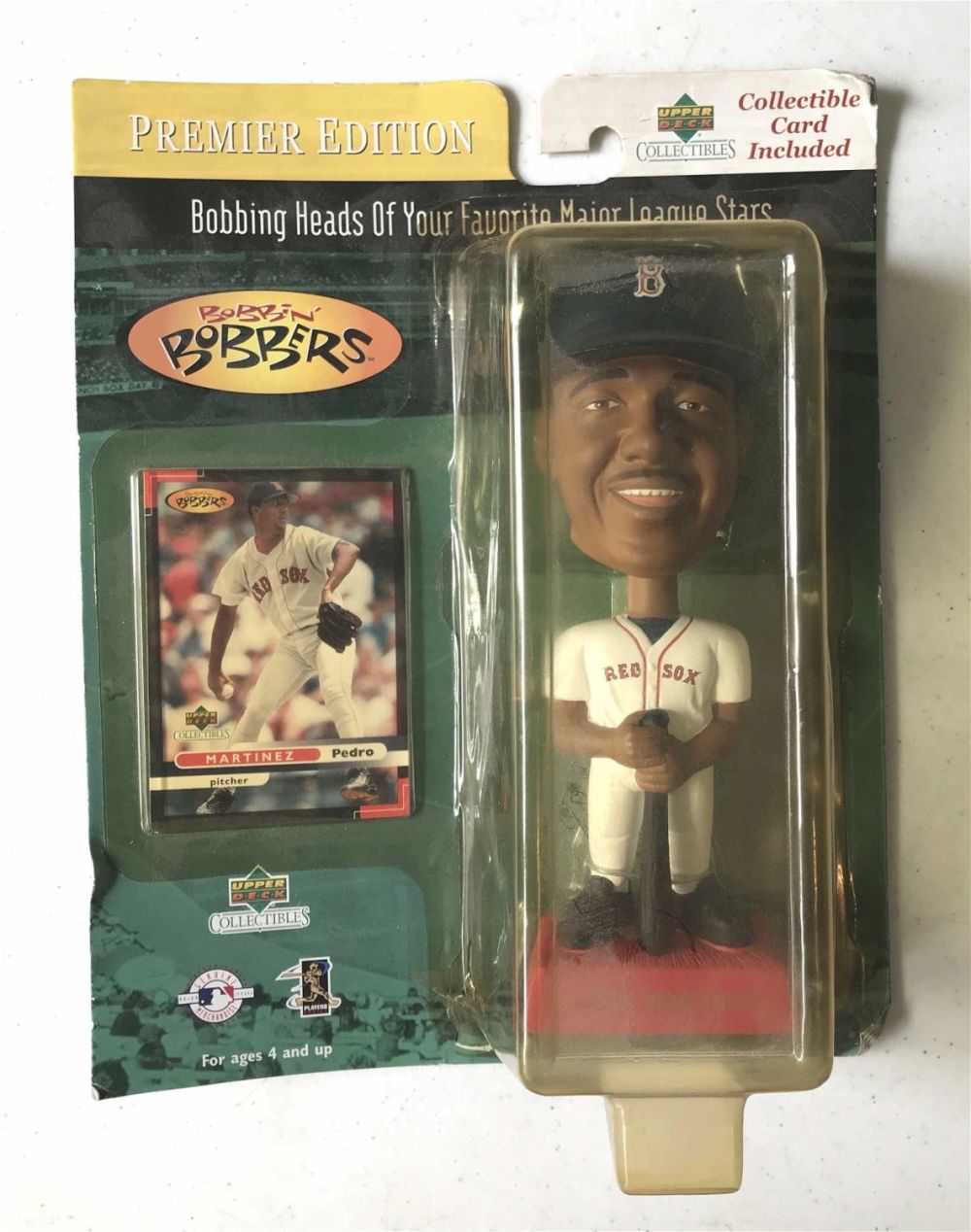 Lot 168: Vintage Pedro Martinez bobble head with collectible card included figurine measures to be 7 inches
