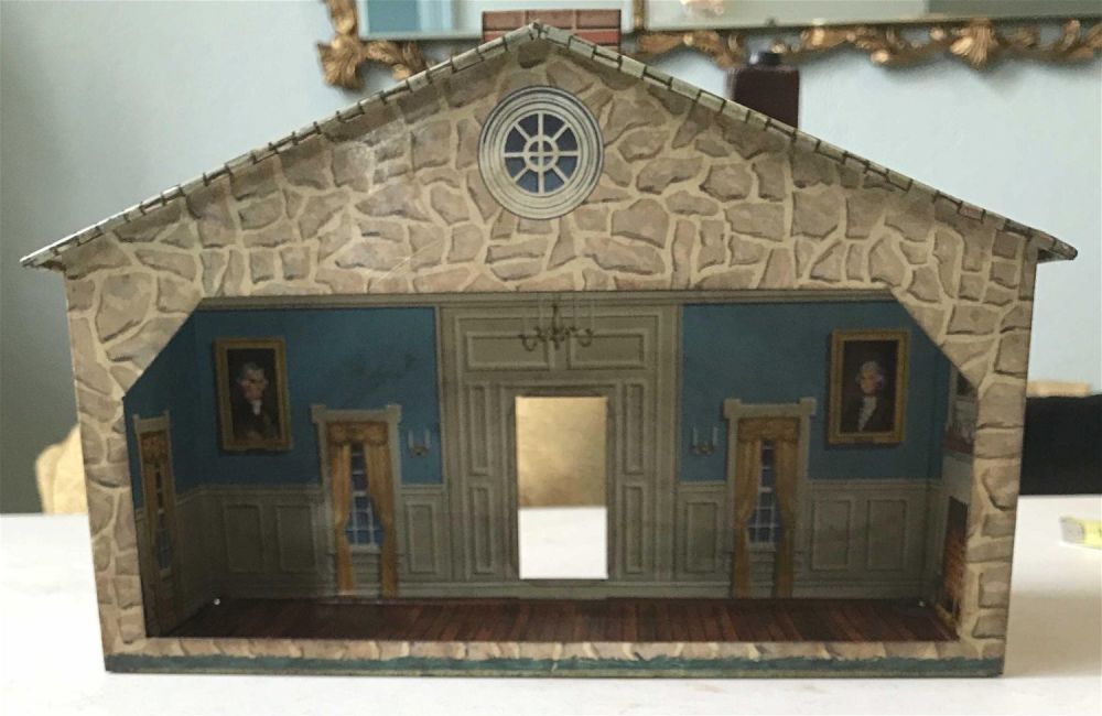 Lot 171: Vintage metal toy house with decorated inside .