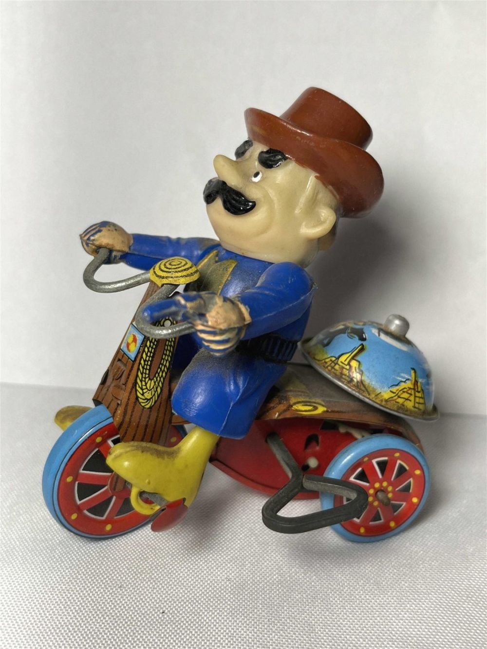 Lot 215: Marx Toys Cowboy on Bell Cycle Works  Measures 4 x 3.5 inches