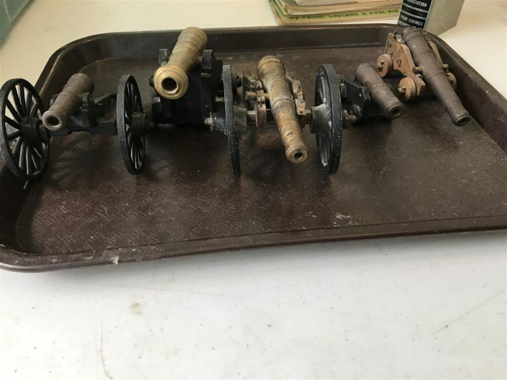 Lot 222: Vintage miniature cannon tray lot. Comes with set of 5 cannons.