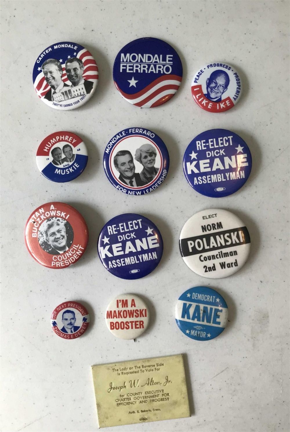 Lot 235: Political Button Collection 12 buttons and 1 advertising handheld mirror