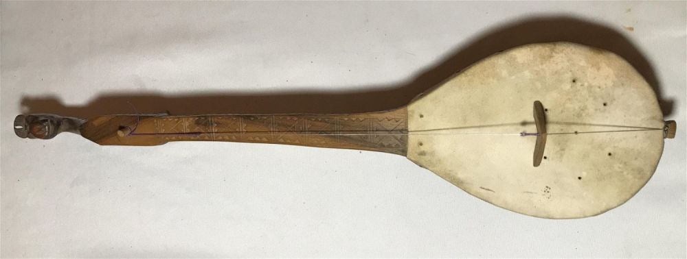 Lot 157: Vintage Lute with a Horse head top, hand carved, decorated piece. Measures to be 4 inches long with