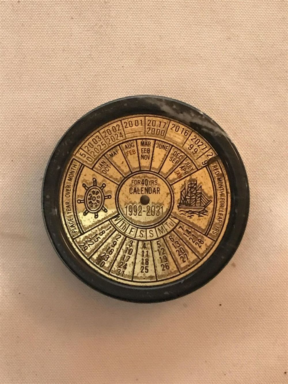 Lot 178: 40 year Calender with marble casing years dating from 1992 to 2031 measures to be a 3 inch diameter