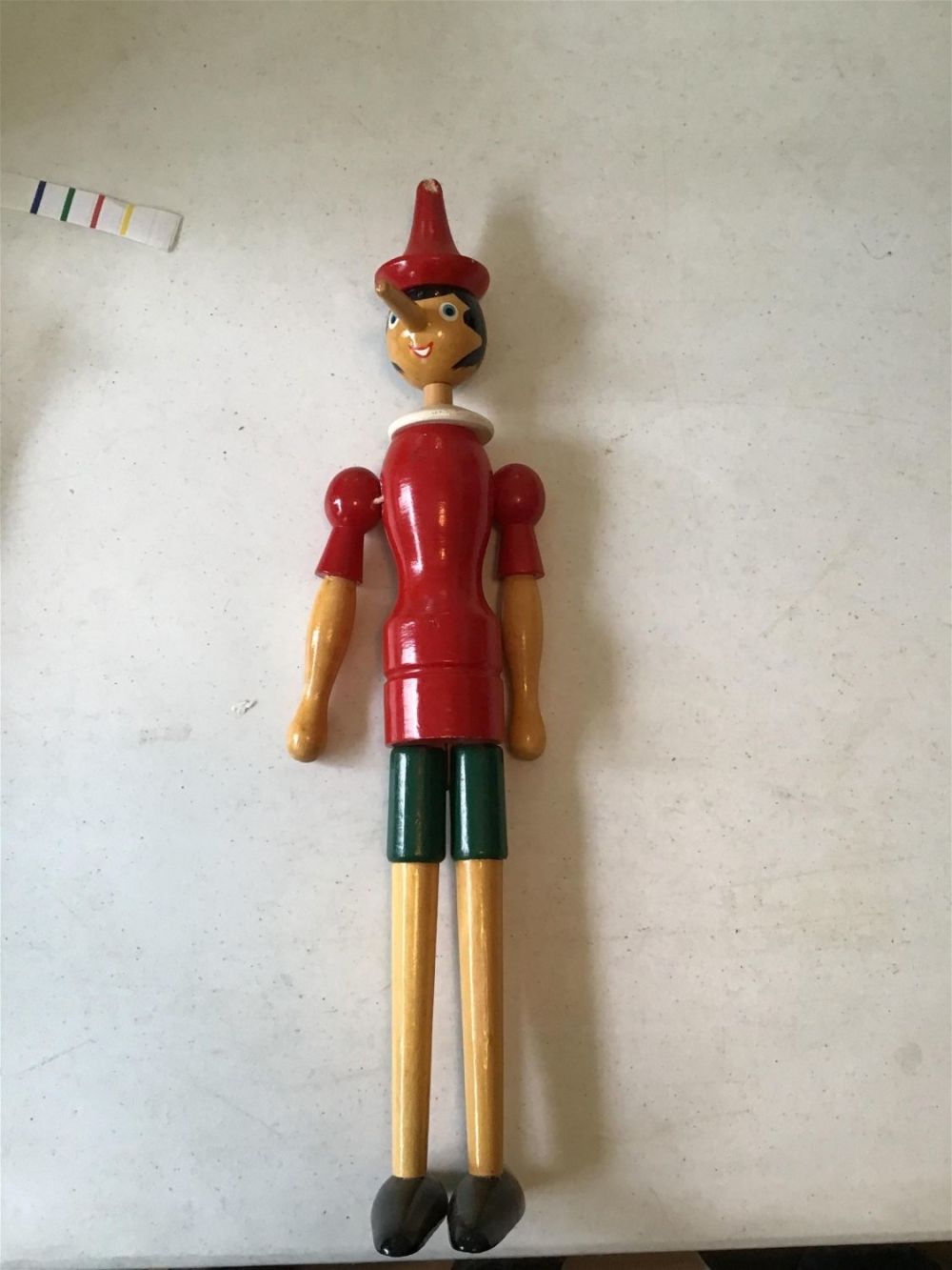 Lot 186: Vintage wooden Pinocchio doll .