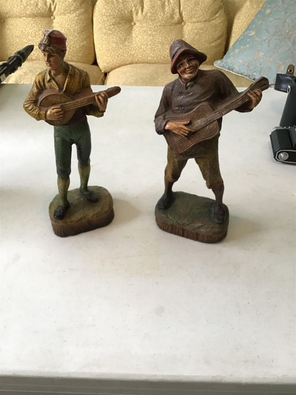 Lot 192: Vintage Syraco wood men playing guitars .