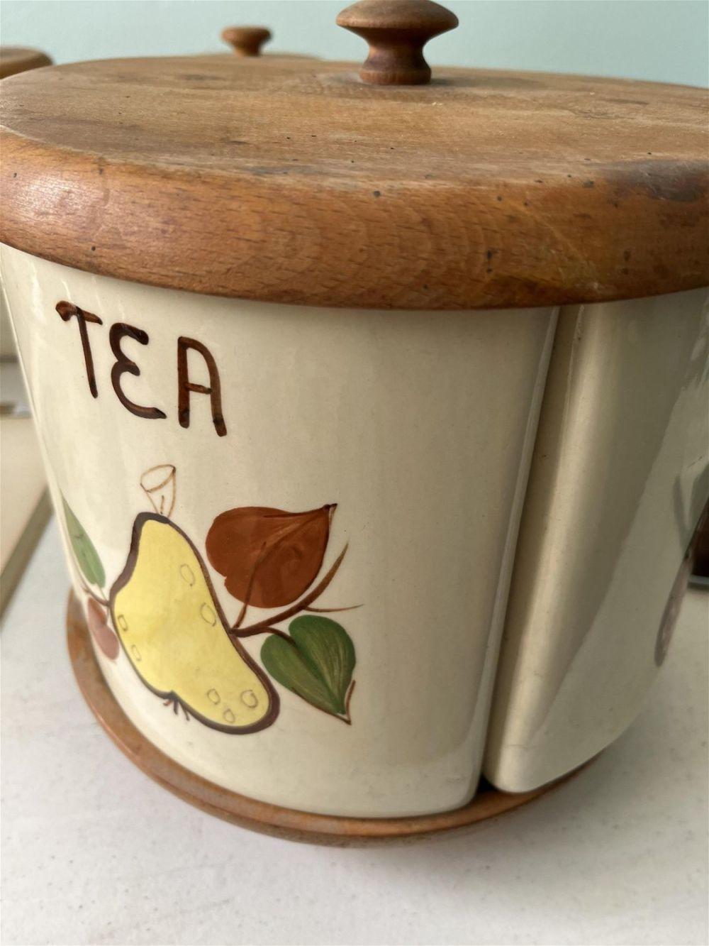 Lot 208: Vintage Spinner Canister Set Wooden base with 4 canisters: flour, coffee, tea &