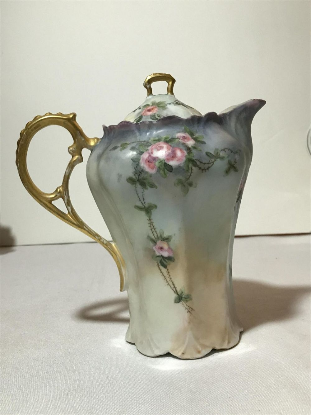 Lot 213: Vintage Hand Painted Chocolate Pitcher Measures approximately 8 inches tall with a base diameter of