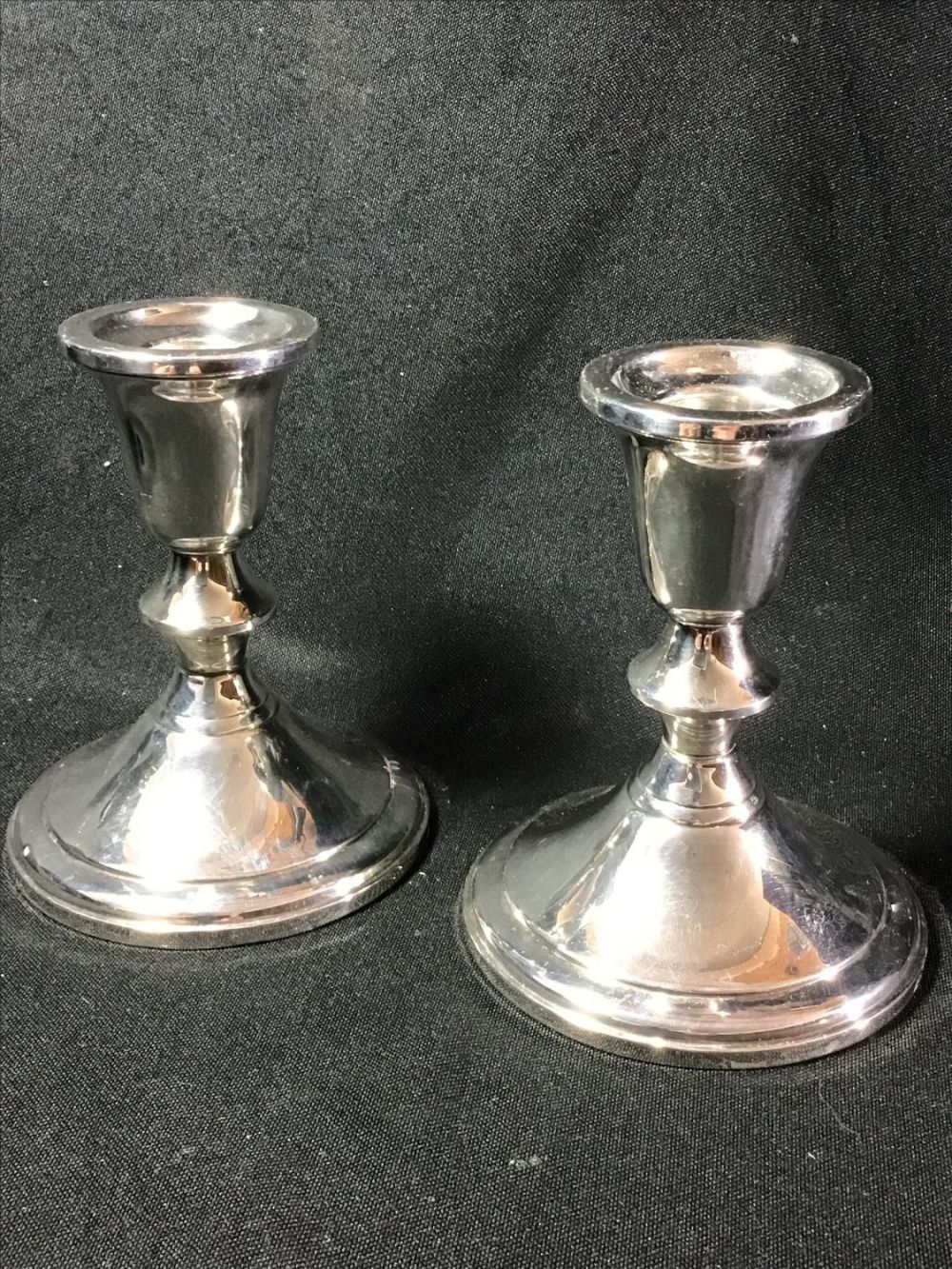 Lot 168: Sterling Towle Candlesticks Each measures 4.5 inches tall by 4 inches diameter