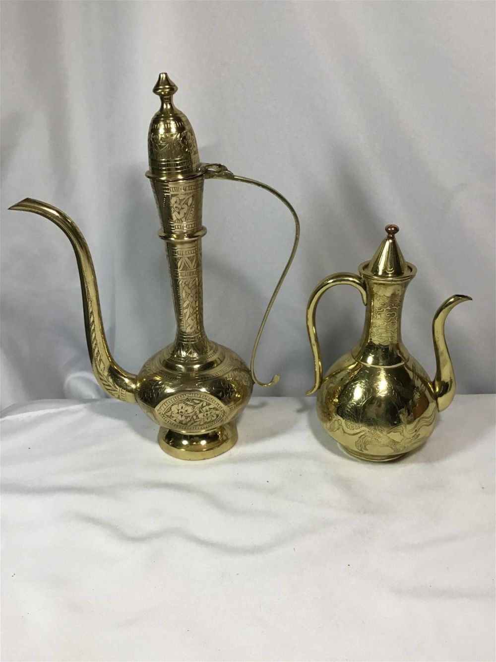 Lot 187: Aladdin Lamps -1 has Dragon motif Taller measures 12.5 dragon lamp measures 8.5 inches tall
