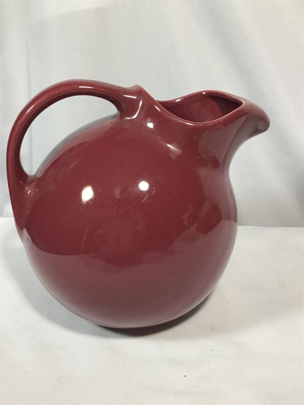 Lot 189: HALL Art Deco Round Pitcher Measures 7 inches tall by 9 inches wide