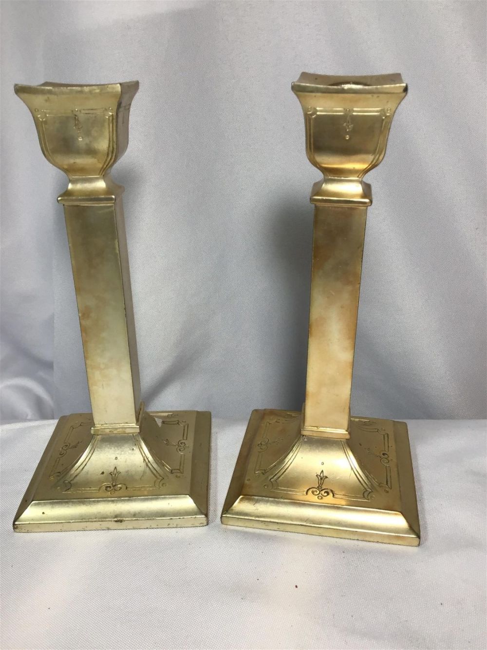 Lot 191: Vintage Silverplate Candlesticks Each measures 8 inches tall