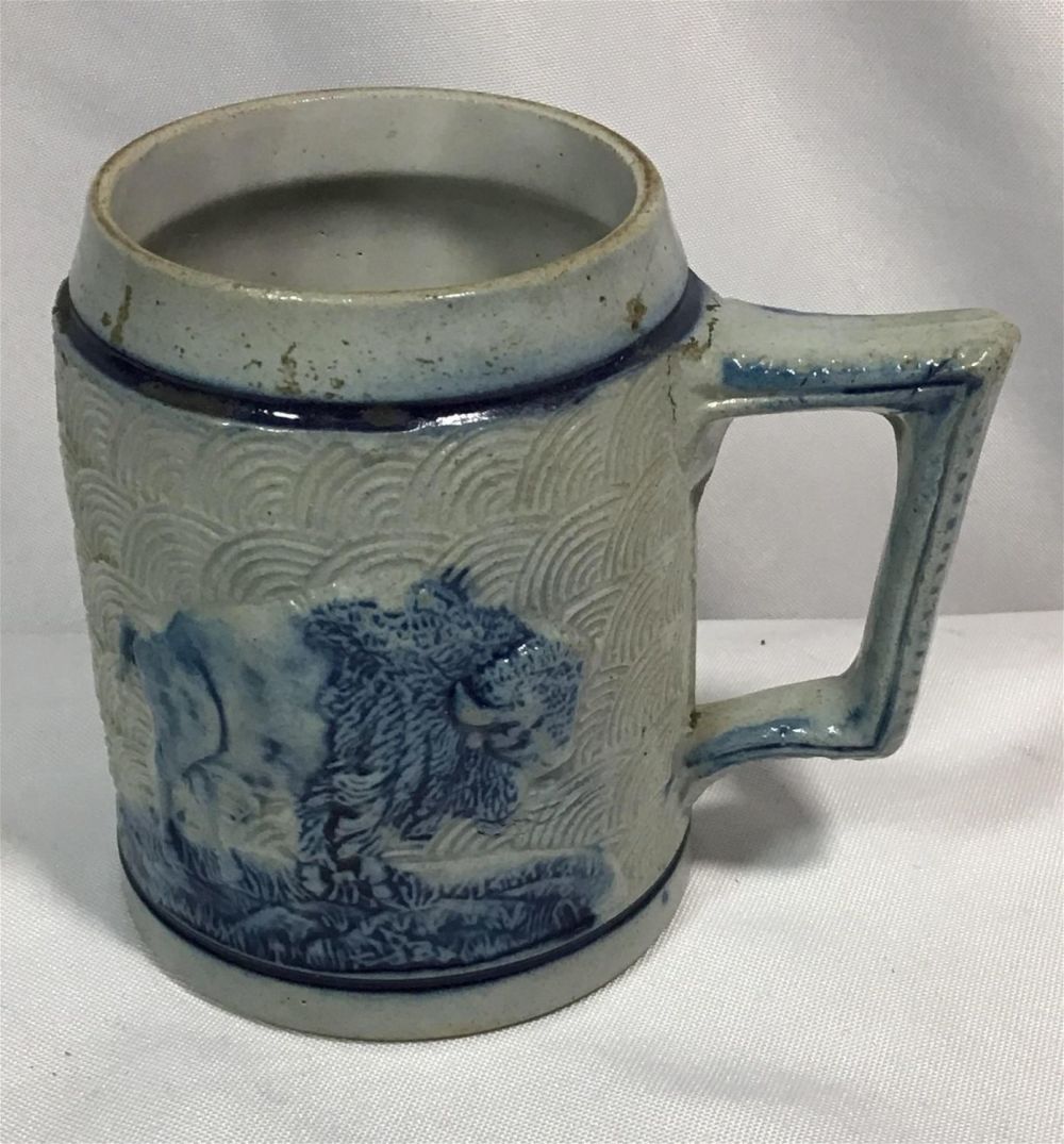 Lot 192: Vintage Buffalo Salt Glazed Drinking Mug Measures 4.5 inches tall