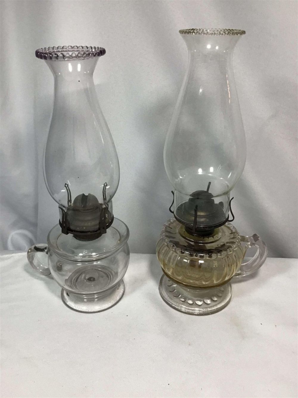 Lot 193: Vintage Oil Lamps (Pair) Each measures approximately 12.5 inches tall with shade