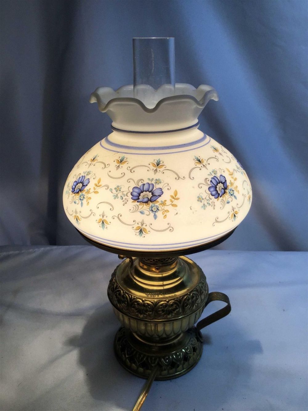 Lot 201: Tiny Junu Glass Shade Lamp Measures 12.5 inches tall with shade